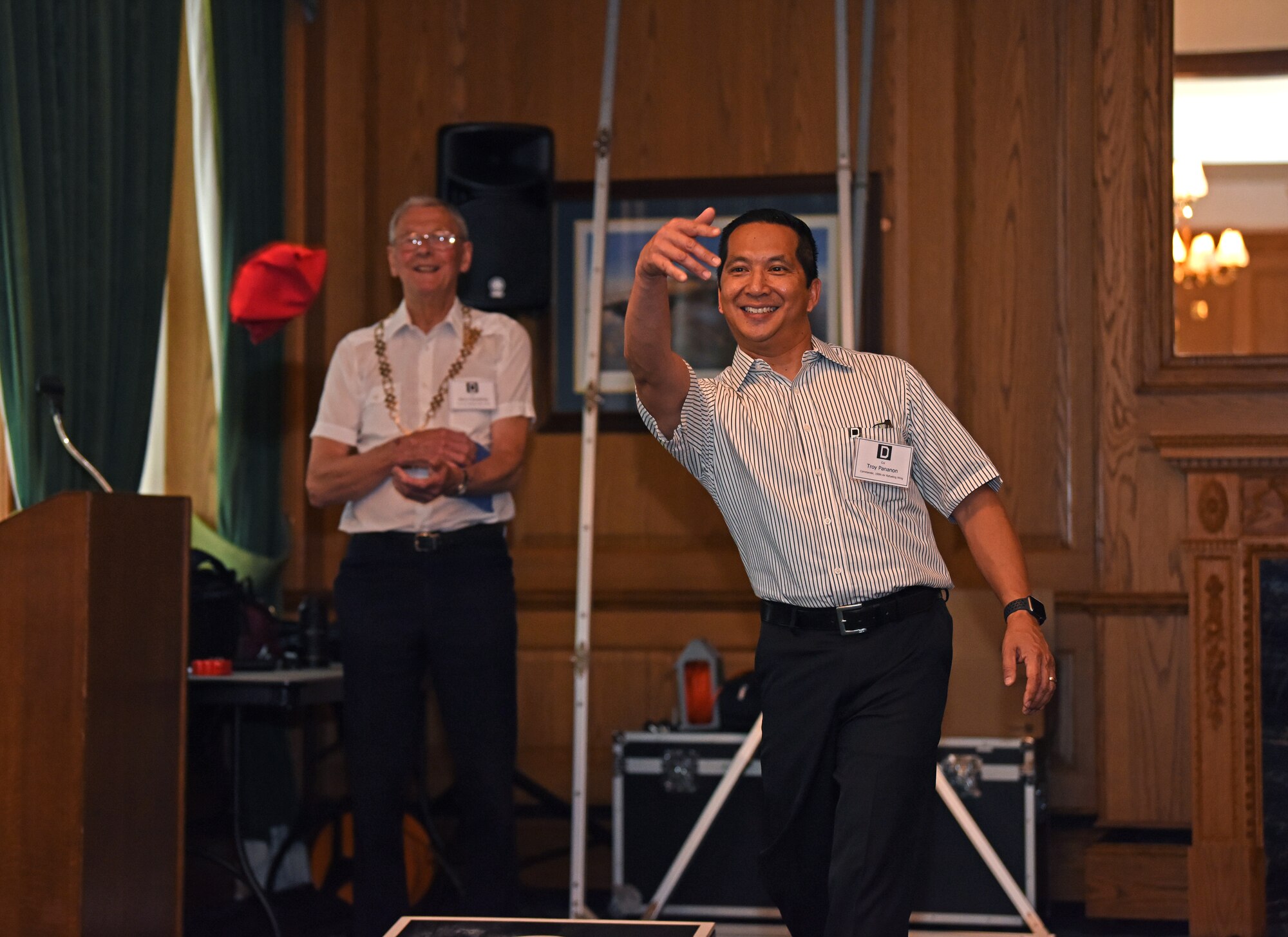 Colonel Troy Pananon, 100th Air Refueling Wing commander, tosses a bean bag during a game of cornhole at the New Mayors’ Barbecue at RAF Mildenhall, July 27, 2019. The annual event consisted of wing mission and economic impact briefs, a KC-135 Stratotanker nose art-themed lunch and friendly games of cornhole. (U.S. Air Force photo by Airman 1st Class Brandon Esau)