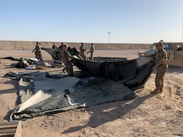 Soldiers of the 129th Support Battalion conduct a Level II Deployment Readiness Exercise to test their ability to go from an alert to establishing mission critical communication and life support systems at Camp Buehring, Kuwait, July 13, 2019.