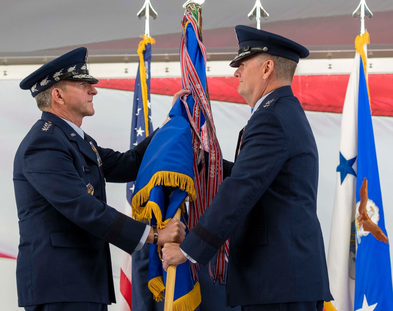 U.S. Air Force Chief of Staff Gen. David L. Goldfein presents the Air Education and Training Command guidon to Lt. Gen. Brad Webb, new commander of AETC, during a change of command ceremony at Joint Base San Antonio-Randolph July 26. Webb, a 1984 graduate of the U.S. Air Force Academy, is a command pilot with more than 3,700 flying hours, including 117 combat hours in Afghanistan, Iraq and Bosnia.