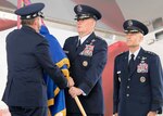 U.S. Air Force Chief of Staff Gen. David L. Goldfein (left) presents the Air Education and Training Command guidon to Lt. Gen. Brad Webb, new commander of AETC, during a change of command ceremony at Joint Base San Antonio-Randolph July 26. At right is U. S. Air Force Lt. Gen. Steve Kwast, outgoing AETC commander. Webb, a 1984 graduate of the U.S. Air Force Academy, is a command pilot with more than 3,700 flying hours, including 117 combat hours in Afghanistan, Iraq and Bosnia.
