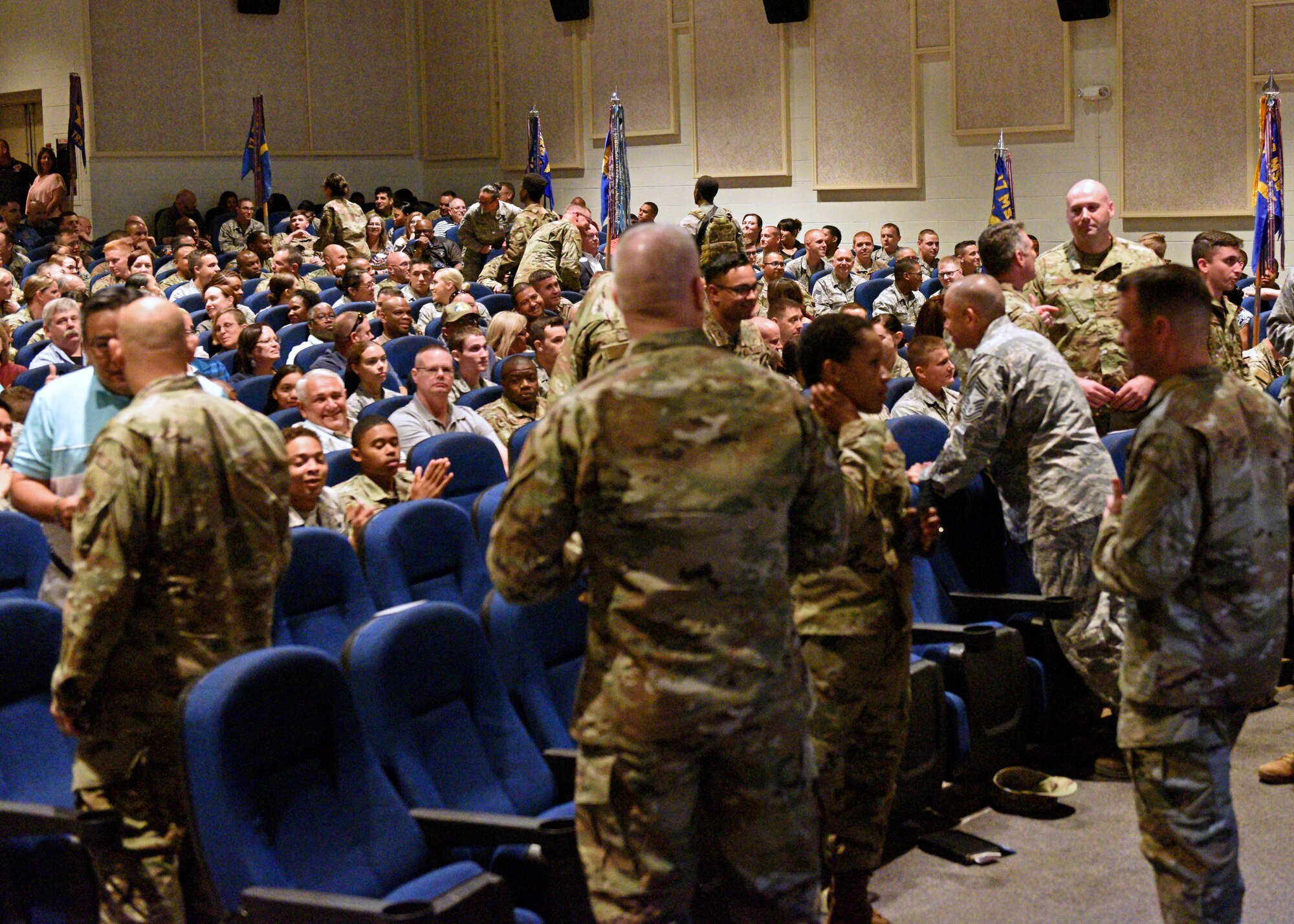 U.S. Air Force Col. Andres Nazario, 17th Training Wing commander, instigated an exercise encouraging personnel to reach out and talk to someone they had not previously met during a commander’s call at the base theater on Goodfellow Air Force Base, Texas, July 25, 2019. This exercise was used to show how interacting with new faces could influence an environment for the better. (U.S. Air Force photo by Airman 1st Class Robyn Hunsinger/Released)