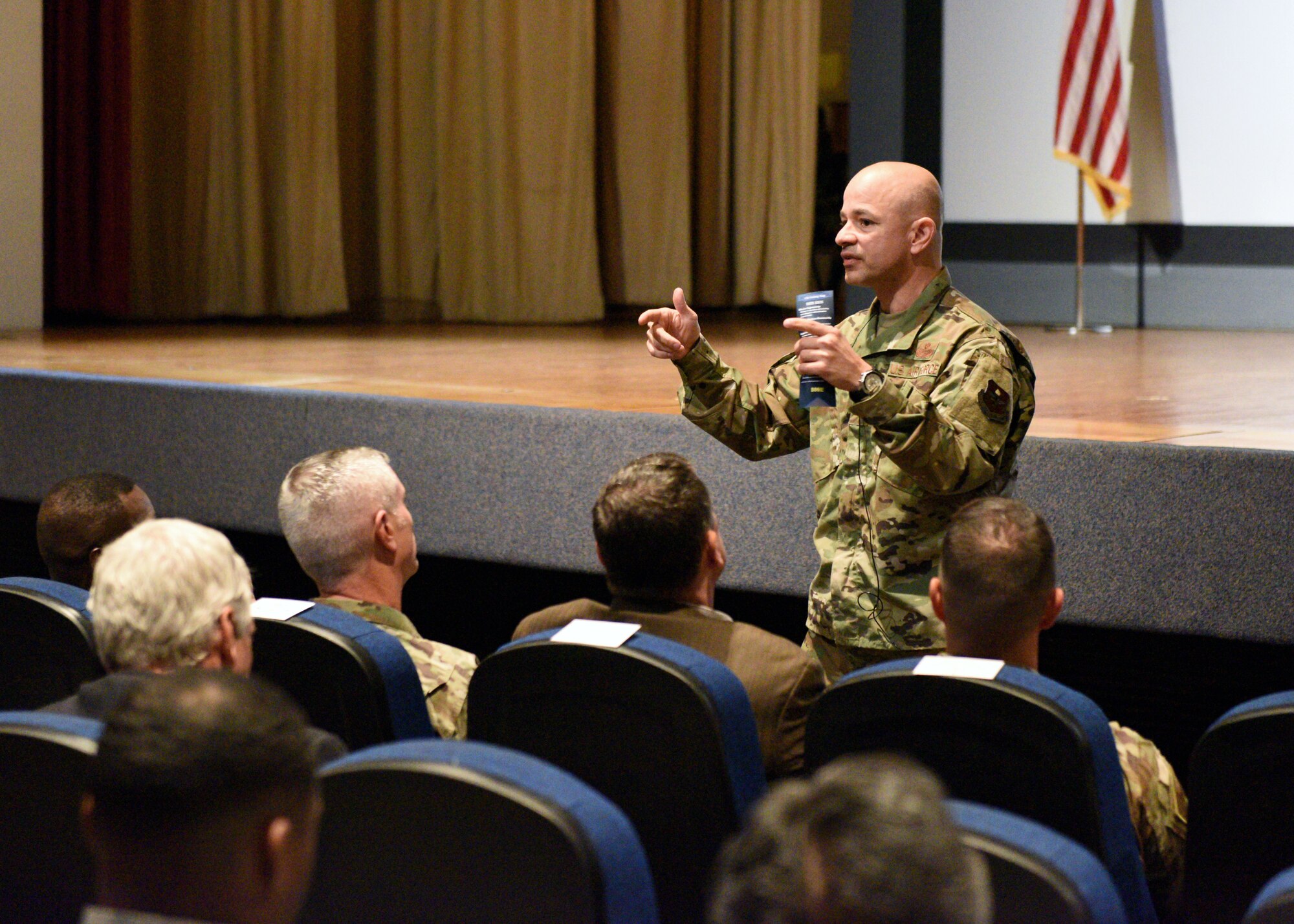 U.S. Air Force Col. Andres Nazario, 17th Training Wing commander, speaks to members of the Goodfellow team about ways he hopes to improve the base environment during a commander’s call at the base theater on Goodfellow Air Force Base, Texas, July 25, 2019. Nazario challenged the attendees to be leaders and revolutionaries in their respective career fields. (U.S. Air Force photo by Airman 1st Class Robyn Hunsinger/Released)