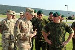 Col. Andrew Inch, 28th Infantry Division chief of staff, talks to Lithuanian Land Forces Army Col. Zilvinas Gaubys, LLF chief of staff, during a tour of monuments at Fort Indiantown Gap July 26, 2019.