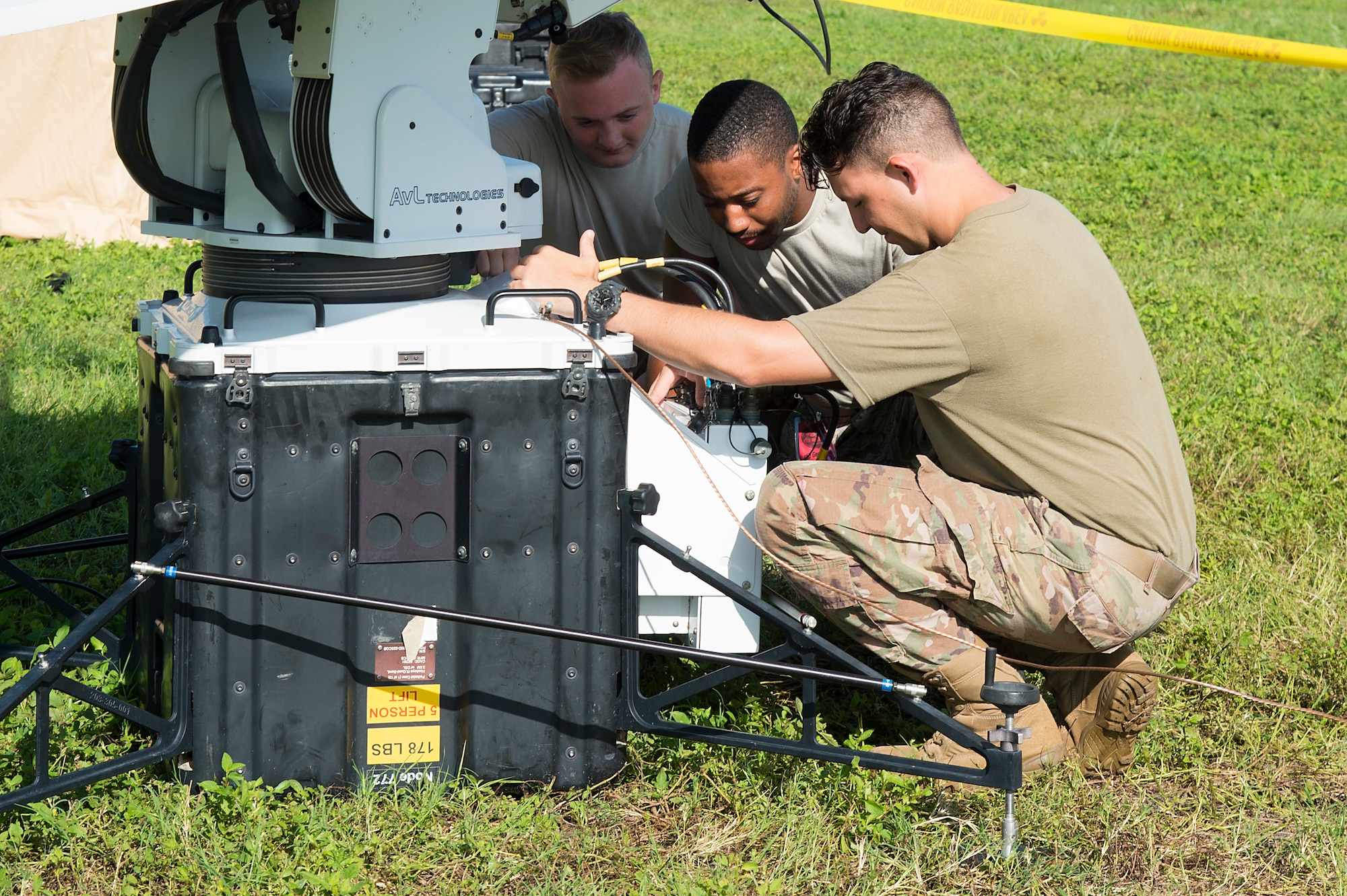 U.S. Air Force Airman 1st Class Caleb Shumaker, Airman 1st Class Andree Dixson and Airman 1st Class Andrew Knudsvig, 27th Special Operations Communication Squadron, expeditionary cyber operations technicians, test a satellite communications system, July 18, 2019, at MacDill Air Force Base, Fla.