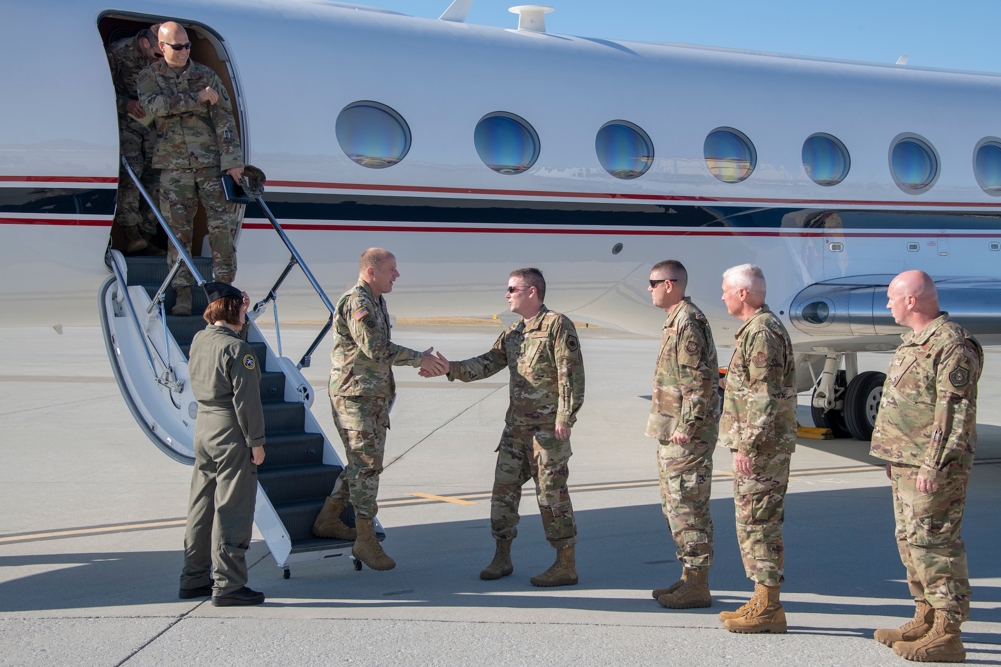 U.S. Army Gen. Steve Lyons, U.S. Transportation Command commander, Scott Air Force Base, Illinois, is welcomed by Col. Jeffrey Nelson, 60th Air Mobility Wing commander, July 24, 2019, at Travis Air Force Base, California. Lyons interacted with Travis Airmen and toured several units while on the base visit. (U.S. Air Force photo by Heide Couch)