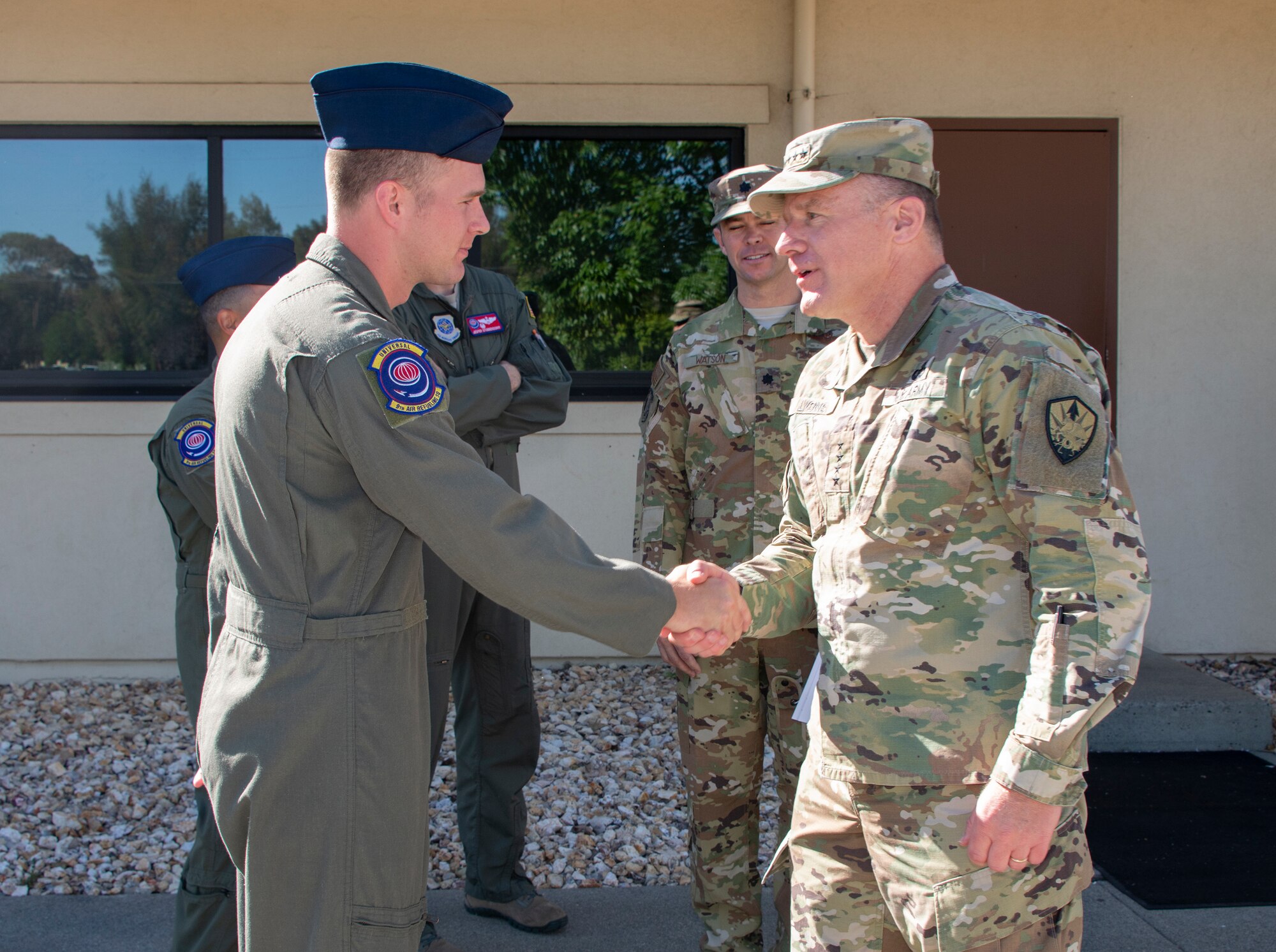 U.S. Army Gen. Steve Lyons, right, U.S. Transportation Command commander, Scott Air Force Base, Illinois, recognizes Airman 1st Class Taran Lewis, 9th Air Refueling Squadron in-flight refueling specialist, for superior performance, July 24, 2019 at Travis Air Force Base, California. Lyons interacted with Travis Airmen and toured several units while on the base visit. (U.S. Air Force photo by Heide Couch)