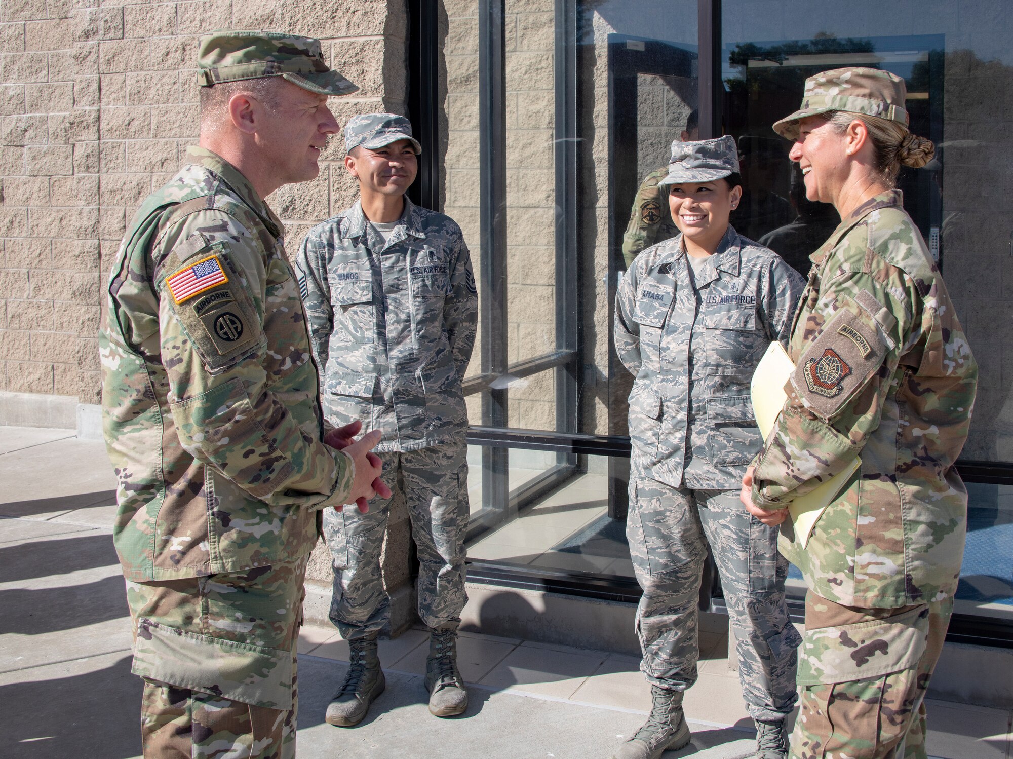 U.S. Army Gen. Steve Lyons, left, U.S. Transportation Command commander, Scott Air Force Base, Illinois, speaks with Col. Kristen Beals, right, 60th Medical Group commander, July 24, 2019 at Travis Air Force Base, California. Lyons had the opportunity to interact with Travis Airmen and tour several units while on the base visit. (U.S. Air Force photo by Heide Couch)