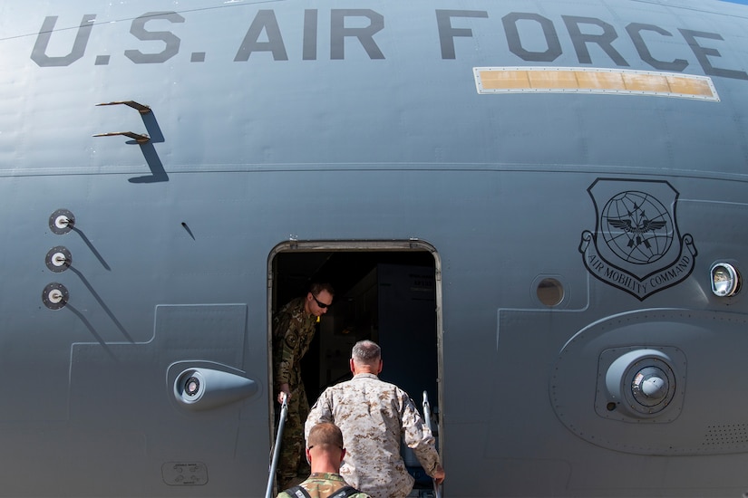 A man walks in a plane.