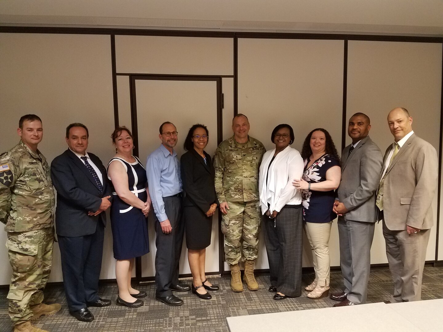 Group of Chaplain Liaisons pose for photo, military and civilian