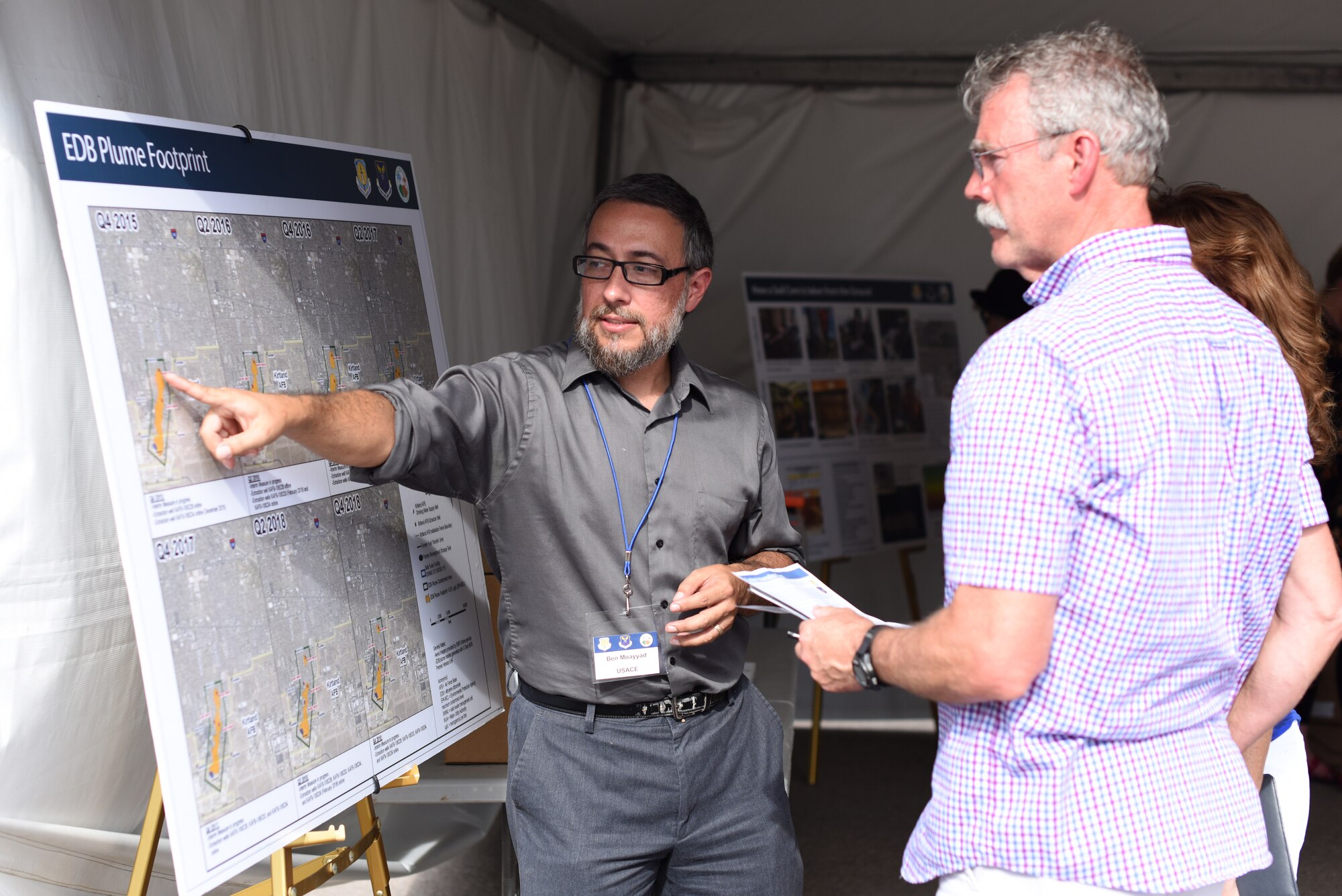 Ben Moayyad, U.S. Army Corps of Engineers project manager, explains the results of the bulk fuels contamination leak cleanup project to attendees of an open house at Kirtland Air Force Base, N.M., July 25, 2019. The open house gave the public a chance to see the treatment facility, learn about and ask questions about the cleanup process. (U.S. Air Force photo by Senior Airman Eli Chevalier)