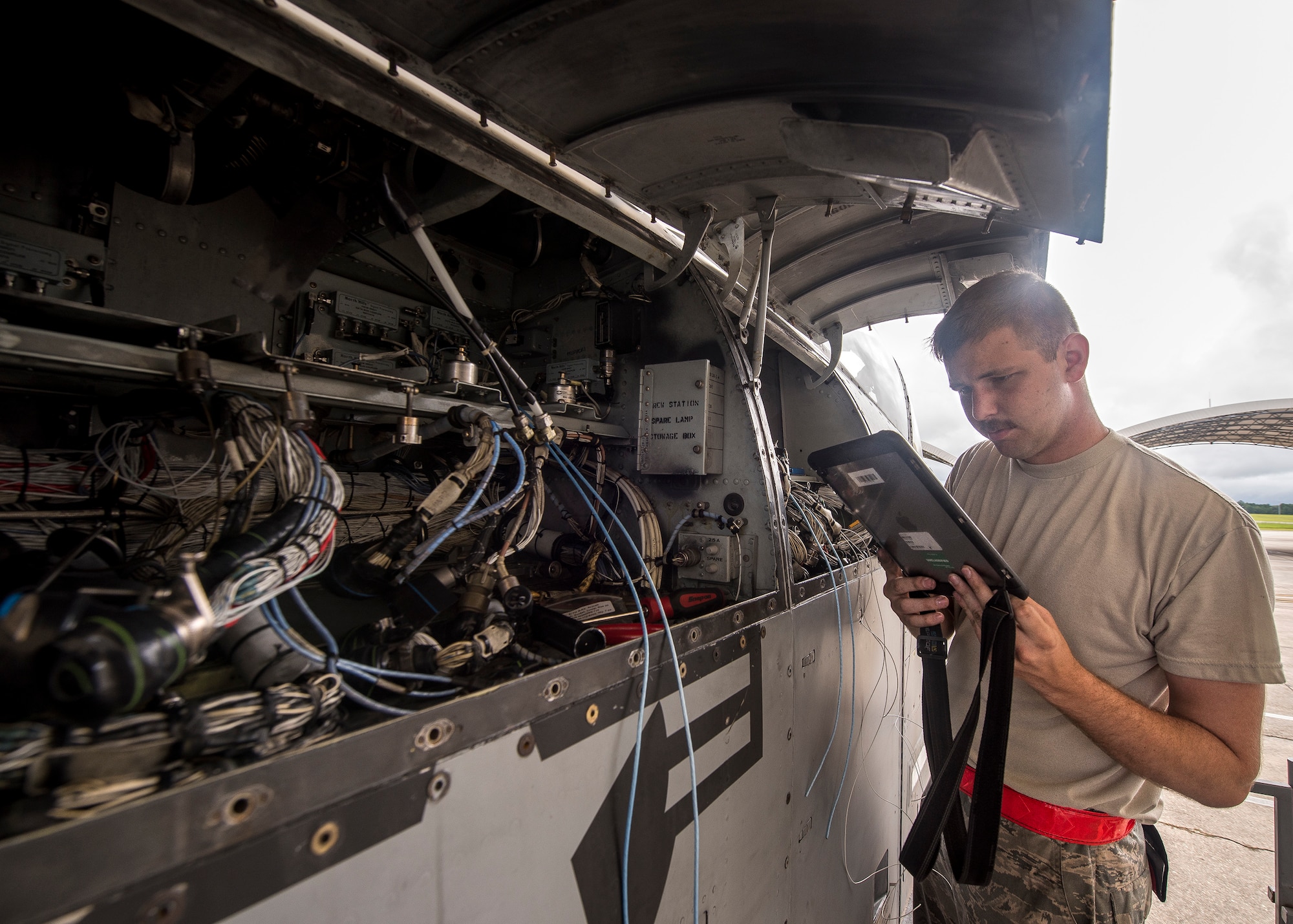 Senior Airman Andrew Bobick, 75th Aircraft Maintenance Unit avionics journeyman, reads a technical order during a sortie surge exercise, July 24, 2019, at Moody Air Force Base, Ga. The exercise was conducted to determine Airmen's abilities to perform effectively while generating combat or training sorties at an accelerated rate. Throughout the four-day surge, pilots and maintainers completed 131 sorties spanning approximately 152 flying hours. (U.S. Air Force photo by Airman 1st Class Eugene Oliver)