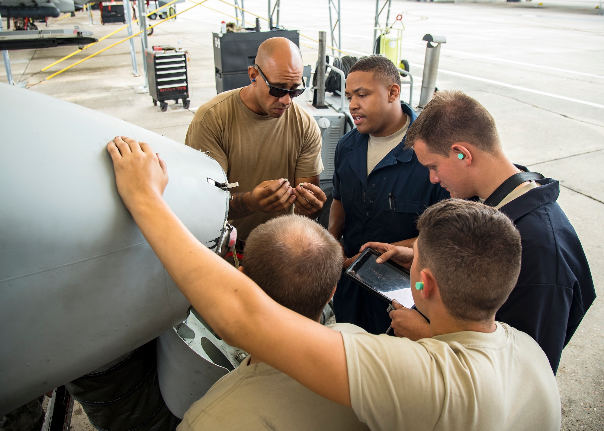 Airmen from the 75th Aircraft Maintenance Unit perform maintenance on an A-10C Thunderbolt II during a sortie surge exercise, July 24, 2019, at Moody Air Force Base, Ga. The exercise was conducted to determine Airmen's abilities to perform effectively while generating combat or training sorties at an accelerated rate. Throughout the four-day surge, pilots and maintainers completed 131 sorties spanning approximately 152 flying hours. (U.S. Air Force photo by Airman 1st Class Eugene Oliver)