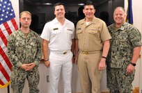 IMAGE: DAHLGREN, Va. (July 17, 2019) – U.S. Naval Academy Midshipman Max Shuman is pictured with the officers he briefed on his Naval Surface Warfare Center Dahlgren Division internship at the command’s Laser Lethality and Development Facility which features an above-ground tunnel used for evaluating high energy laser weapon systems. Pictured left to right: Lt. Adam Mattison, Shuman, Cmdr. Steven Perchalski, and Lt. Paul Cross.