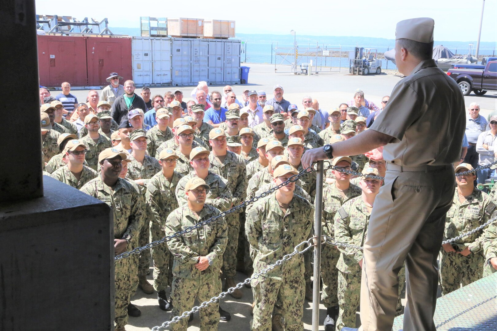 Rear Adm. Tom Anderson speaks to Sailors and civilians at Puget Sound Naval Shipyard & Intermediate Maintenance Facility Everett Detachment during an all-hands presentation in Everett, Washington. Anderson is Commander, Navy Regional Maintenance Center and Naval Sea Systems Deputy Commander, Ship Maintenance and Modernization and visited Northwest Regional Maintenance Center on Jul 22.