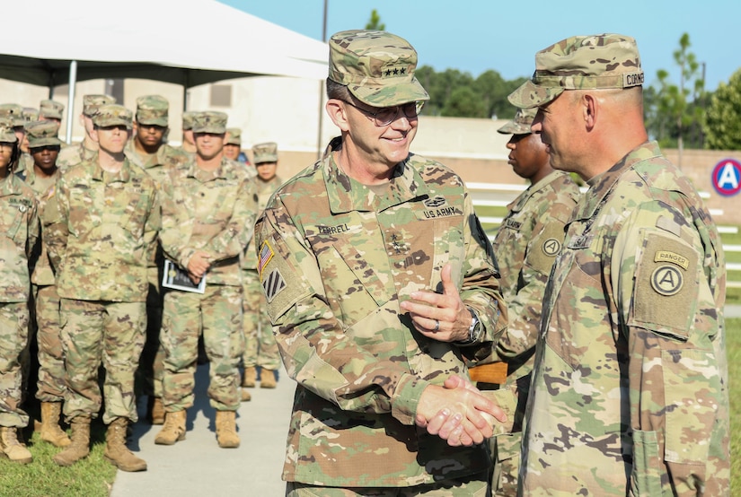 Lt. Gen. Terry Ferrell (Left), commanding general of U.S. Army Central, pins on Sgt. Maj. Curt Cornelison’s Distinguished Service Medal before Cornelison’s relinquishment of responsibility ceremony at USARCENT’s headquarters, Shaw Air Force Base, S.C., Jul. 29, 2019. Cornelison was recently selected to serve as the U.S. Army Forces Command senior enlisted advisor, a 4-star command located at Fort Bragg, N.C., and largest U.S. Army command with more than 750,000 Active Army, U.S. Army Reserve and U.S. Army National Guard Soldiers.