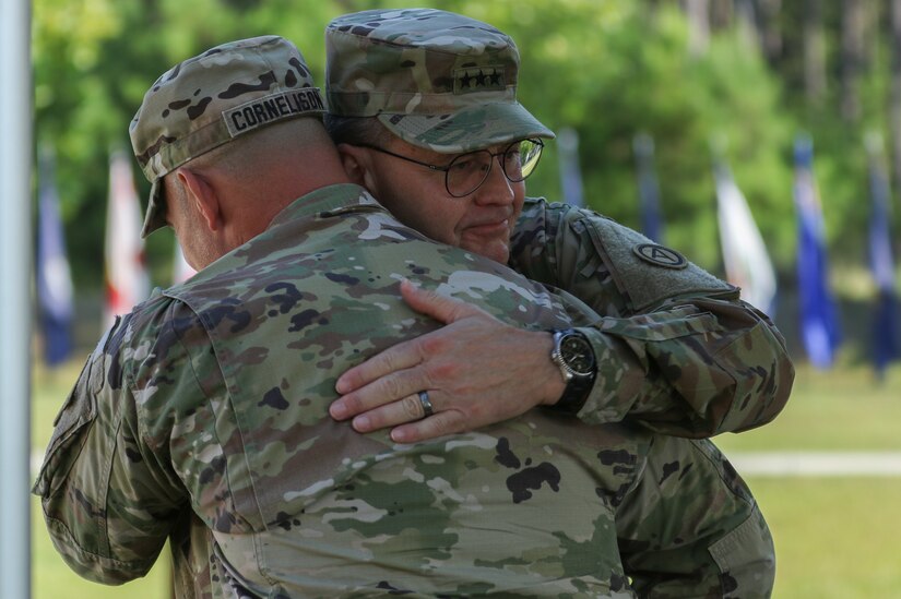 Lt. Gen. Terry Ferrell (left), commanding general of U.S. Army Central, embraces Sgt. Maj. Curt Cornelison, former senior enlisted advisor to USARCENT, in a hug during Cornelison’s relinquishment of responsibility ceremony at USARCENT’s headquarters, Shaw Air Force Base, S.C., Jul. 29, 2019. Cornelison was recently selected to serve as the U.S. Army Forces Command senior enlisted advisor, a 4-star command located at Fort Bragg, N.C., and largest U.S. Army command with more than 750,000 Active Army, U.S. Army Reserve and U.S. Army National Guard Soldiers.