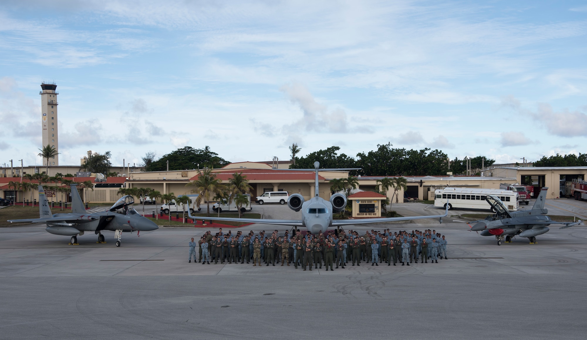 U.S. Air Force and Republic of Singapore Air Force personnel stand in front of (from left to right) an F-15C Eagle from the 122nd Fighter Squadron from the 159th Fighter Wing of the New Orleans Air National Guard, Louisiana, and an RSAF G550 Airborne Early Warning aircraft and an RSAF F-16 at Andersen Air Force Base, Guam, July 9, 2019. Approximately 150 RSAF aircrew and ground crew deployed to Andersen AFB for a month to conduct bilateral training with the U.S. Air Force’s 122nd FS to increase both countries’ interoperability and build upon the United States’ and the Republic of Singapore’s excellent and longstanding bilateral defense relationship. (U.S. Air Force Photo by Airman 1st Class Amir Young)