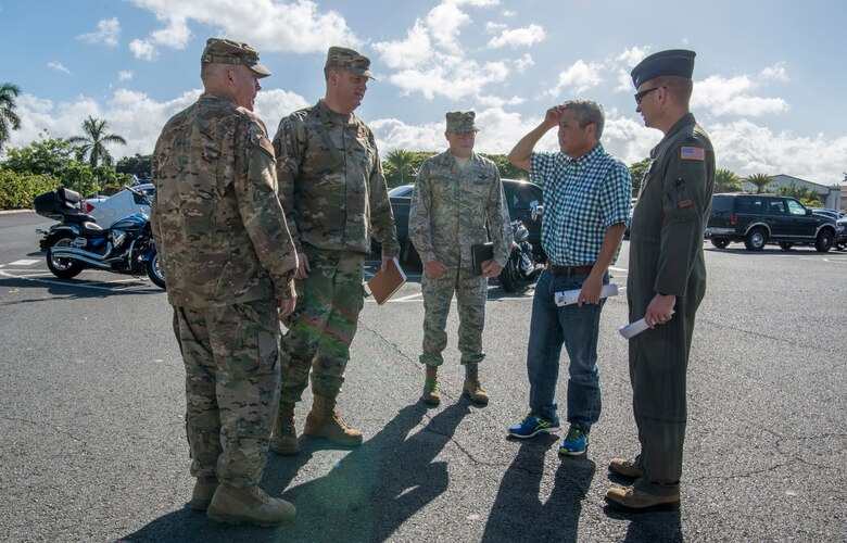 U.S. Air Force leadership greet Hawaii State Legislative representative Scott K. Saiki, Speaker of the House in front of the Pacific Air Forces Headquarters July, 24, 2019. Eleven Hawaii legislatures visited with U.S. Air Force representatives in an effort to broaden understandings of Air Force missions, capabilities, roles and responsibilities. (U.S. Air Force photo by Staff Sgt. Jack Sanders)