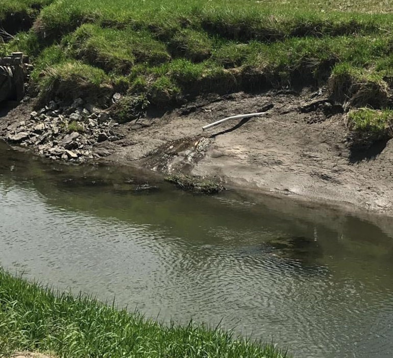 Damage to a riverside berm drain identified during an initial damage assessment May 3, 2019.