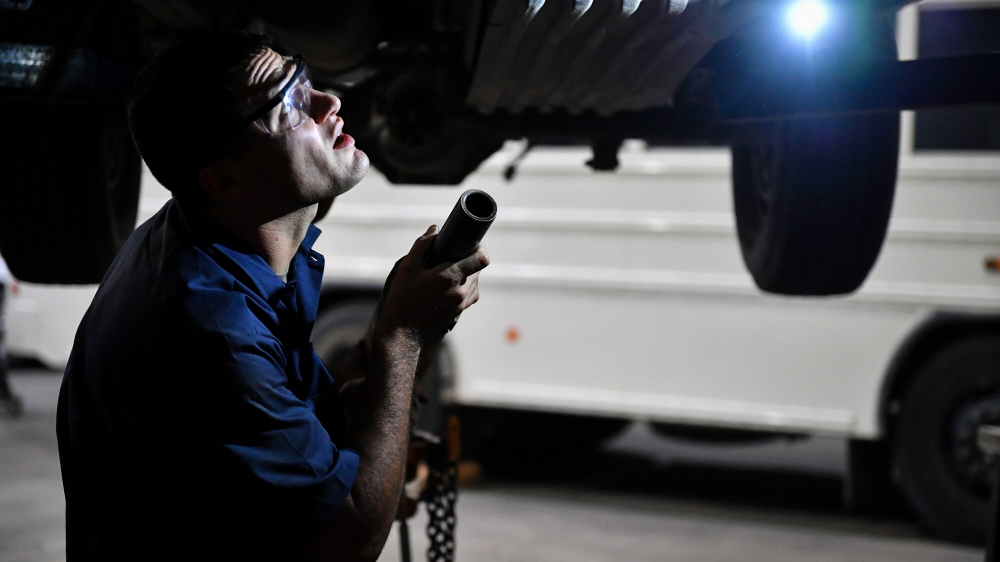 U.S. Air Force Senior Airman Darian O’Banion, 386th Expeditionary Logistics Readiness Squadron vehicle and equipment maintenance journeyman, prepares to install a driveshaft on a vehicle at Ali Al Salem Air Base, Kuwait, July 29, 2019. The driveshaft is a rotating part which transmits torque in an engine to the wheels of the vehicle. (U.S. Air Force photo by Staff Sgt. Mozer O. Da Cunha)
