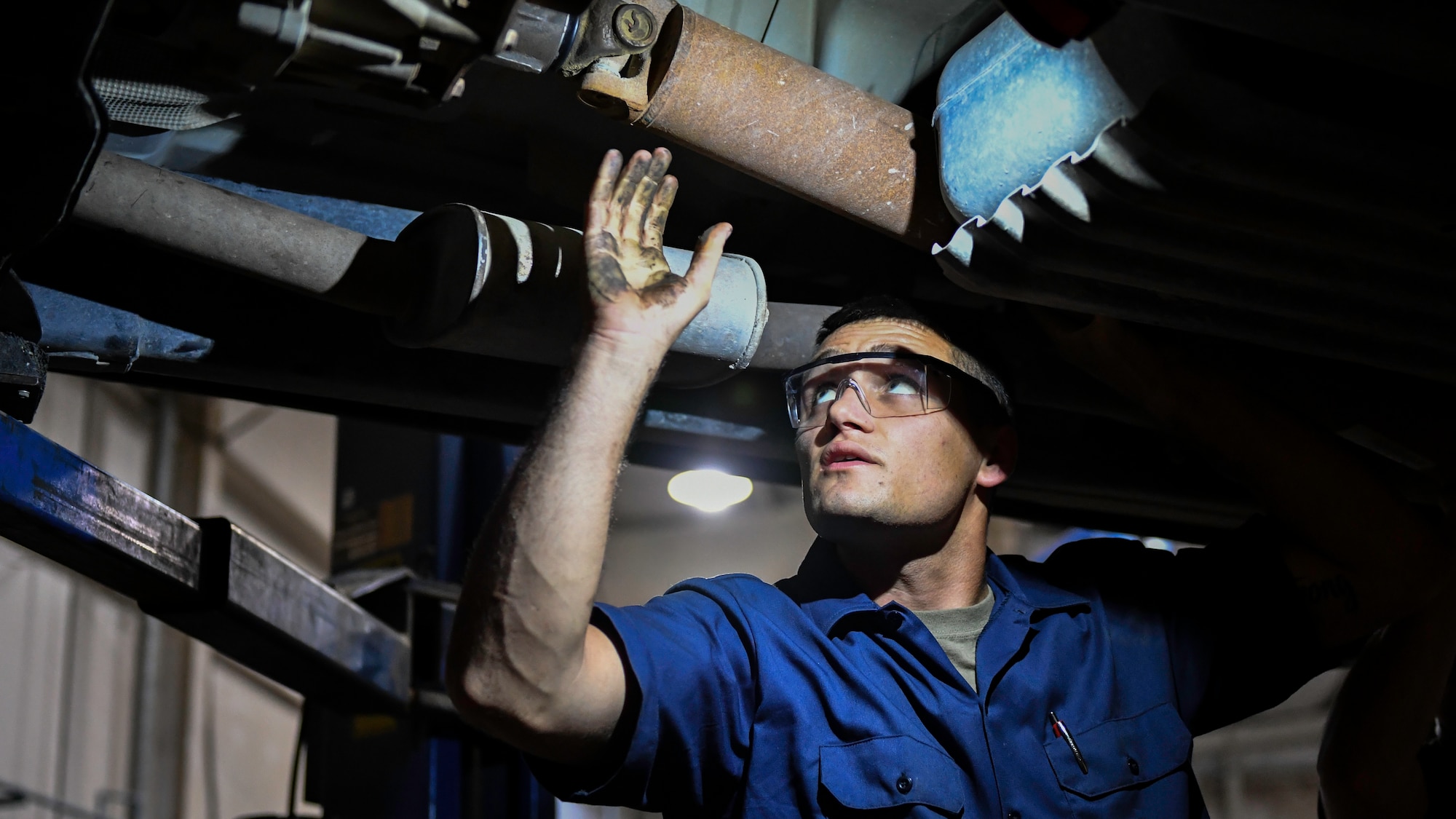 U.S. Air Force Senior Airman Darian O’Banion, 386th Expeditionary Logistics Readiness Squadron vehicle and equipment maintenance journeyman, lines up a driveshaft for installation on a vehicle at Ali Al Salem Air Base, Kuwait, July 29, 2019. The driveshaft is a mechanical component for transmitting torque and rotation, usually used to connect other components of a drive train that cannot be connected directly because of distance or the need to allow for relative movement between them. (U.S. Air Force photo by Staff Sgt. Mozer O. Da Cunha)