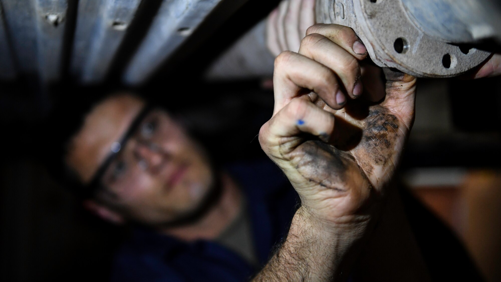 U.S. Air Force Senior Airman Darian O’Banion, 386th Expeditionary Logistics Readiness Squadron vehicle and equipment maintenance journeyman, secures a driveshaft to a vehicle with a bolt at Ali Al Salem Air Base, Kuwait, July 29, 2019. The driveshaft is a mechanical component for transmitting torque and rotation, usually used to connect other components of a drive train that cannot be connected directly because of distance or the need to allow for relative movement between them. (U.S. Air Force photo by Staff Sgt. Mozer O. Da Cunha)