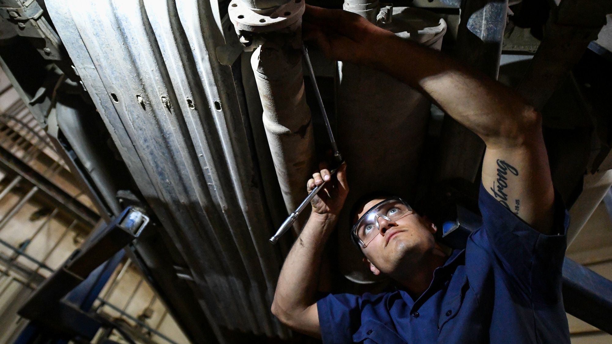 U.S. Air Force Senior Airman Darian O’Banion, 386th Expeditionary Logistics Readiness Squadron vehicle and equipment maintenance journeyman, secures a driveshaft to a vehicle at Ali Al Salem Air Base, Kuwait, July 29, 2019. Airmen assigned to the vehicle and equipment maintenance shop work on an average of 10 different automobiles a week. (U.S. Air Force photo by Staff Sgt. Mozer O. Da Cunha)
