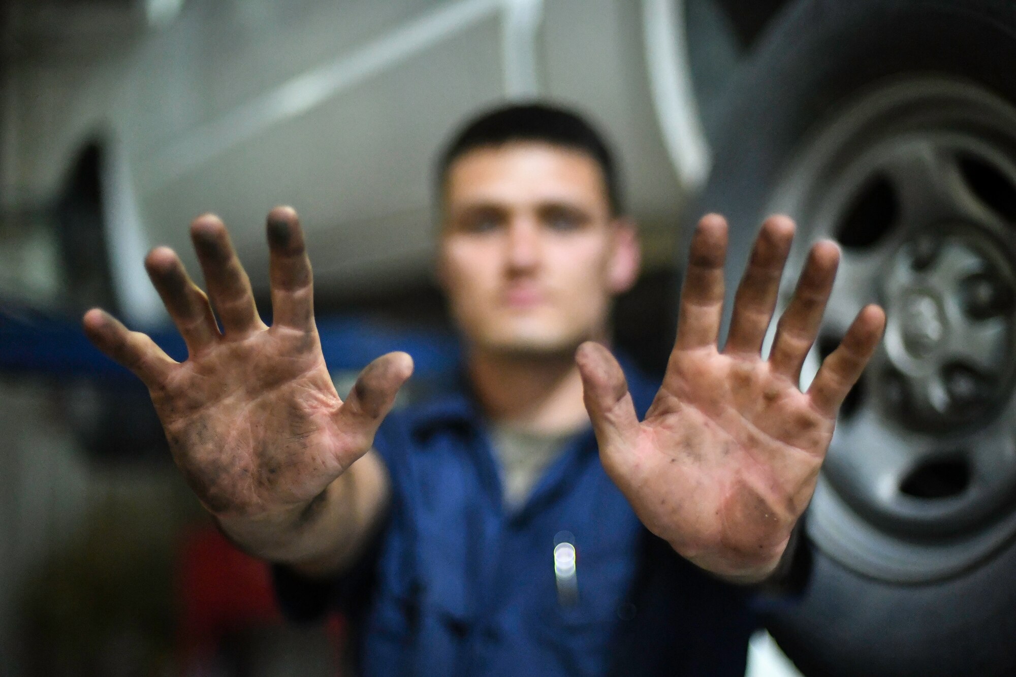 U.S. Air Force Senior Airman Darian O’Banion, 386th Expeditionary Logistics Readiness Squadron vehicle and equipment maintenance journeyman, poses for a photo at Ali Al Salem Air Base, Kuwait, July 29, 2019. Airmen assigned to the vehicle and equipment maintenance shop work on an average of 10 different automobiles a week. (U.S. Air Force photo by Staff Sgt. Mozer O. Da Cunha)