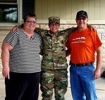 Staff Sgt. Ashley Munger, AGR Army recruiter, Shellbyville Army Recruiting Station, Indiana, with her parents Glenda and Steve Munger.