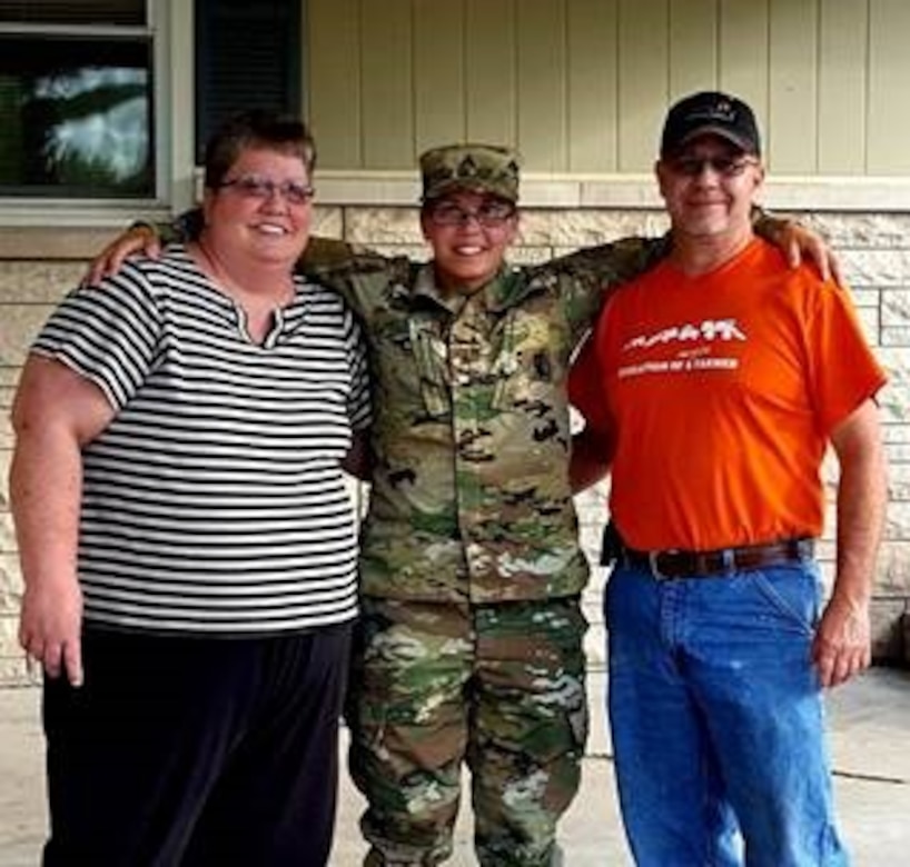 Staff Sgt. Ashley Munger, AGR Army recruiter, Shellbyville Army Recruiting Station, Indiana, with her parents Glenda and Steve Munger.