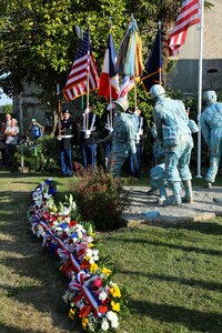 Color Guard Soldiers assigned to the 7th Mission Support Command stand in front of the Four Braves Memorial in Periers, France during the 75th Anniversary of the liberation of the town on July 27, 2019. The 90th Infantry Division, now the 90th Sustainment Brigade, liberated the town during World War II seven weeks after landing on Utah beach just 35 kilometers away. (U.S. Army Reserve Photo by Capt. Joe Bush)