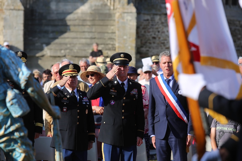 Brig. Gen. Michael T. Harvey, commanding general of the 7th Mission Support Command, and Col. James Bramble salute the Four Braves Memorial in Periers, France on July 27, 2019 after laying a wreath in remembrance of the American Soldiers who fought and died to liberate towns like Periers during Operation Overlord in World War II. The 90th Infantry Division, now the 90th Sustainment Brigade, liberated the town seven weeks after landing on Utah beach just 35 kilometers away. (U.S. Army Reserve Photo by Capt. Joe Bush)