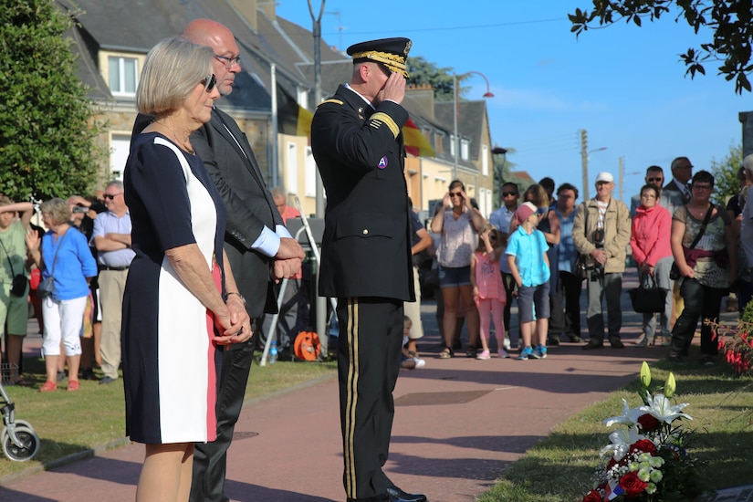 Brig. Gen. Michael T. Harvey, commanding general of the 7th Mission Support Command, salutes the Four Braves Memorial in Periers, France on July 27, 2019 after laying a wreath in remembrance of the American Soldiers who fought and died to liberate towns like Periers during Operation Overlord in World War II. The 90th Infantry Division, now the 90th Sustainment Brigade, liberated the town seven weeks after landing on Utah beach just 35 kilometers away. (U.S. Army Reserve Photo by Capt. Joe Bush)