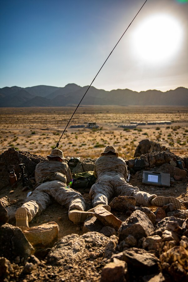U.S. Marines with Scout Sniper Platoon, 1st Battalion, 25th Marine Regiment, 4th Marine Division, call in coordinates for a call-for-fire drill at Marine Corps Air Ground Combat Center Twentynine Palms, Calif., July 27, 2019, during Integrated Training Exercise 5-19. After ITX 5-19, 1st Battalion, 25th Marine Regiment will be activated and deploy to the Indo-Pacific Command to conduct multiple exercises across the region. ITX measures the unit’s ability to provide a cohesive, trained, and ready capability in support of service and Combatant Commander requirements. (U.S. Marine Corps photo by Sgt. Andy O. Martinez)