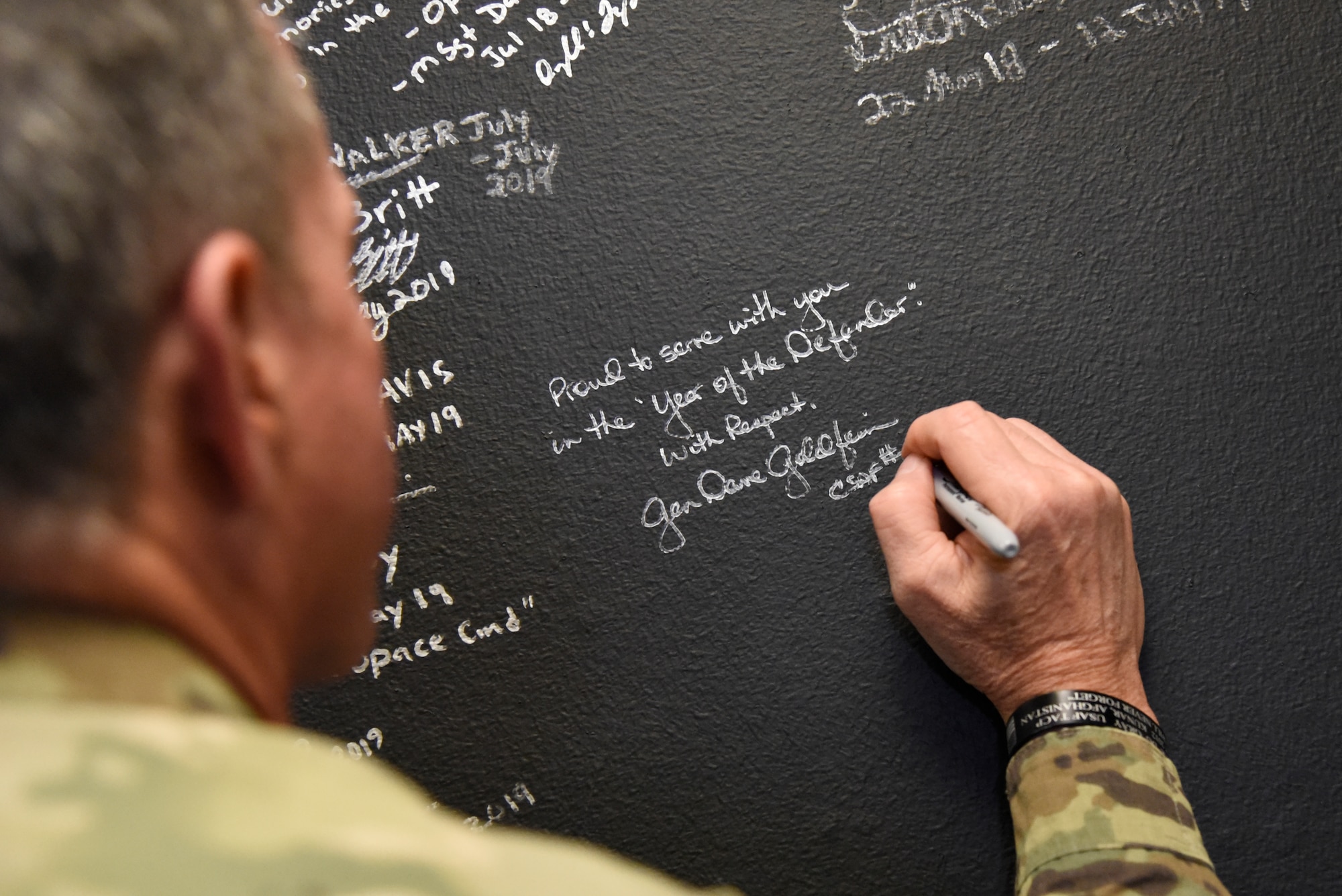 The 21st Air Force Chief of Staff David Goldfein, signs the 821st Security Forces Squadron’s Defender wall during his visit to Thule Air Base, Greenland July 20, 2019. Thule AB was the last stop of a 10-day visit with allies and partners in Europe including Estonia, Finland, United Kingdom, Germany and Greenland. (U.S. Air Force photo by Staff Sgt. Alexandra M. Longfellow)