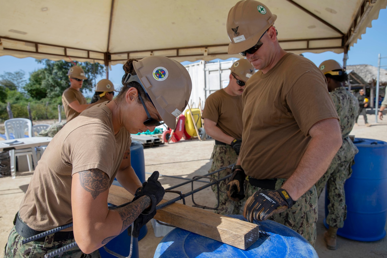 U.S. Navy Seabees tie rebar.