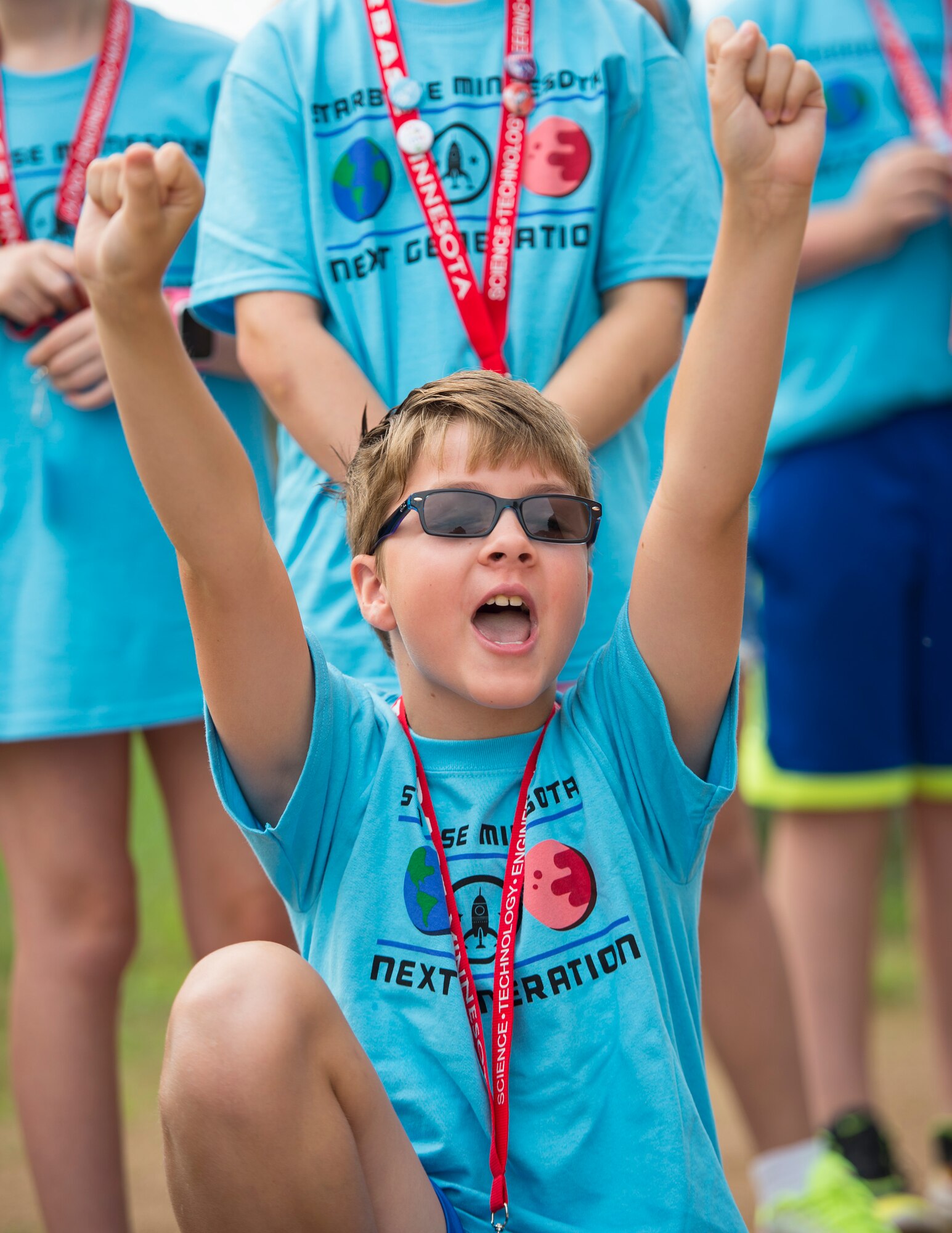 A student from STARBASE Minnesota celebrates after his rocket’s parachute opens in St. Paul, Minn., July 18, 2019.
