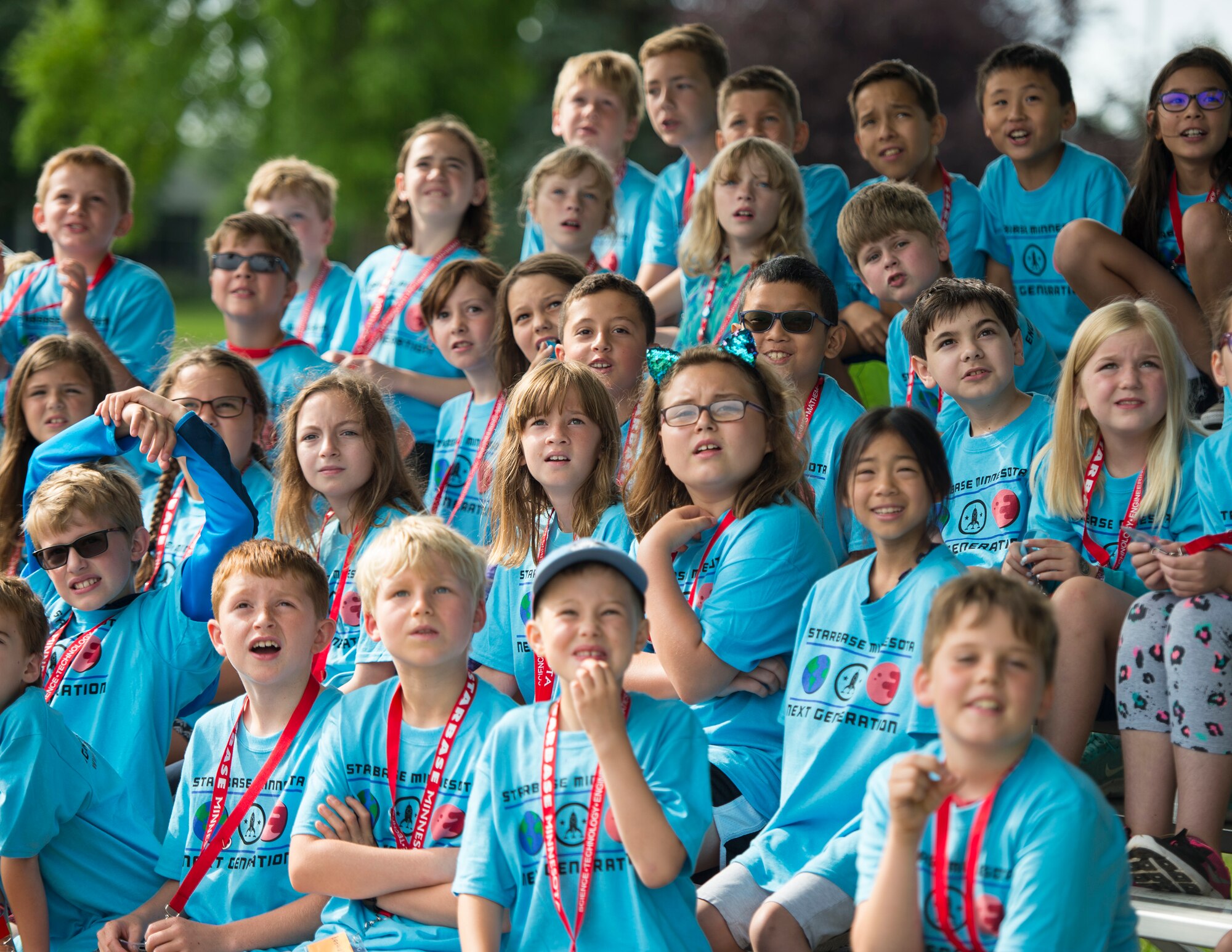 Students from STARBASE Minnesota watch rockets blast off from the launch pad in St. Paul, Minn., July 18, 2019.