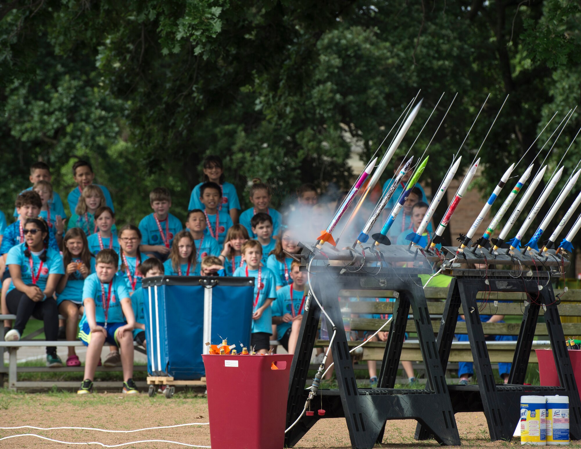 Students from STARBASE Minnesota watch rockets blast off from the launch pad in St. Paul, Minn., July 18, 2019.