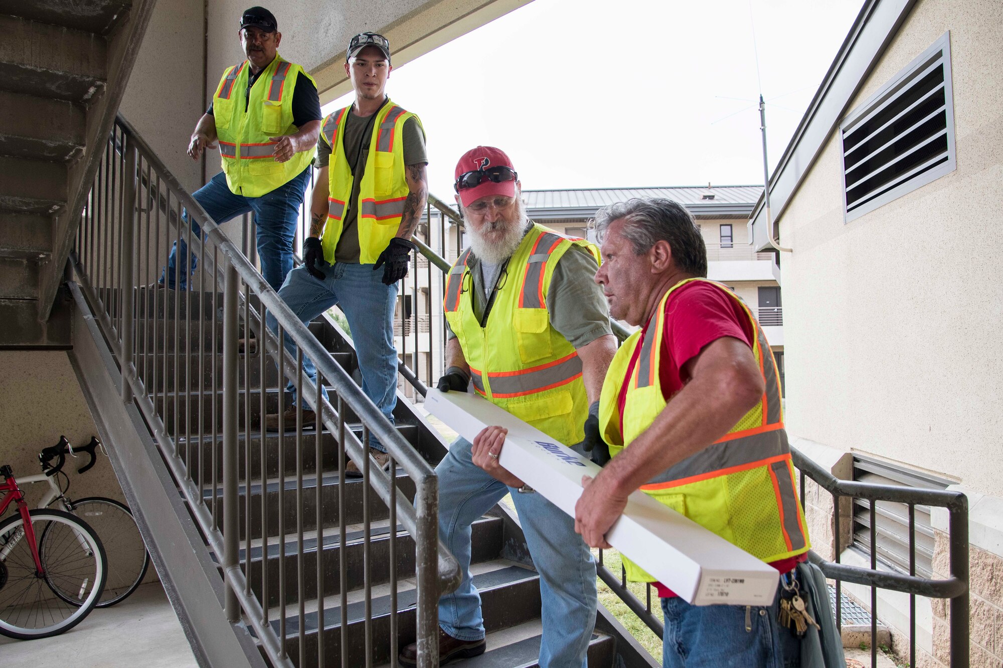 Professionals from the 502nd Air Base Wing Civil Engineer Group work to remediate dorms with mold on Monday, July 29, 2019 and Joint Base San Antonio–Lackland. The mold remediation is taking place after Airmen at JBSA-Lackland voiced their concerns. (U.S. Air Force photo by Sean Worrell)