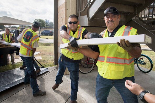 Professionals from the 502nd Air Base Wing Civil Engineer Group work to remediate dorms with mold on Monday, July 29, 2019 and Joint Base San Antonio–Lackland. The mold remediation is taking place after Airmen at JBSA-Lackland voiced their concerns. (U.S. Air Force photo by Sean Worrell)