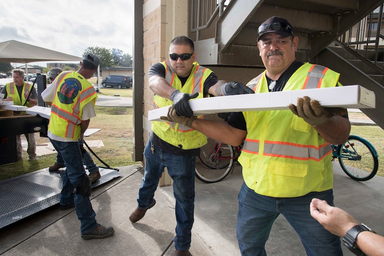 Professionals from the 502nd Air Base Wing Civil Engineer Group work to remediate dorms with mold on Monday, July 29, 2019 and Joint Base San Antonio–Lackland. The mold remediation is taking place after Airmen at JBSA-Lackland voiced their concerns. (U.S. Air Force photo by Sean Worrell)