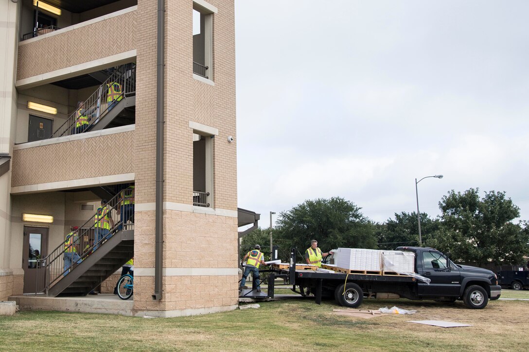 Professionals from the 502nd Air Base Wing Civil Engineer Group work to remediate dorms with mold on Monday, July 29, 2019 and Joint Base San Antonio–Lackland. The mold remediation is taking place after Airmen at JBSA-Lackland voiced their concerns. (U.S. Air Force photo by Sean Worrell)