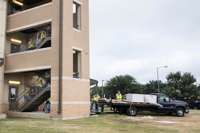 Professionals from the 502nd Air Base Wing Civil Engineer Group work to remediate dorms with mold on Monday, July 29, 2019 and Joint Base San Antonio–Lackland. The mold remediation is taking place after Airmen at JBSA-Lackland voiced their concerns. (U.S. Air Force photo by Sean Worrell)