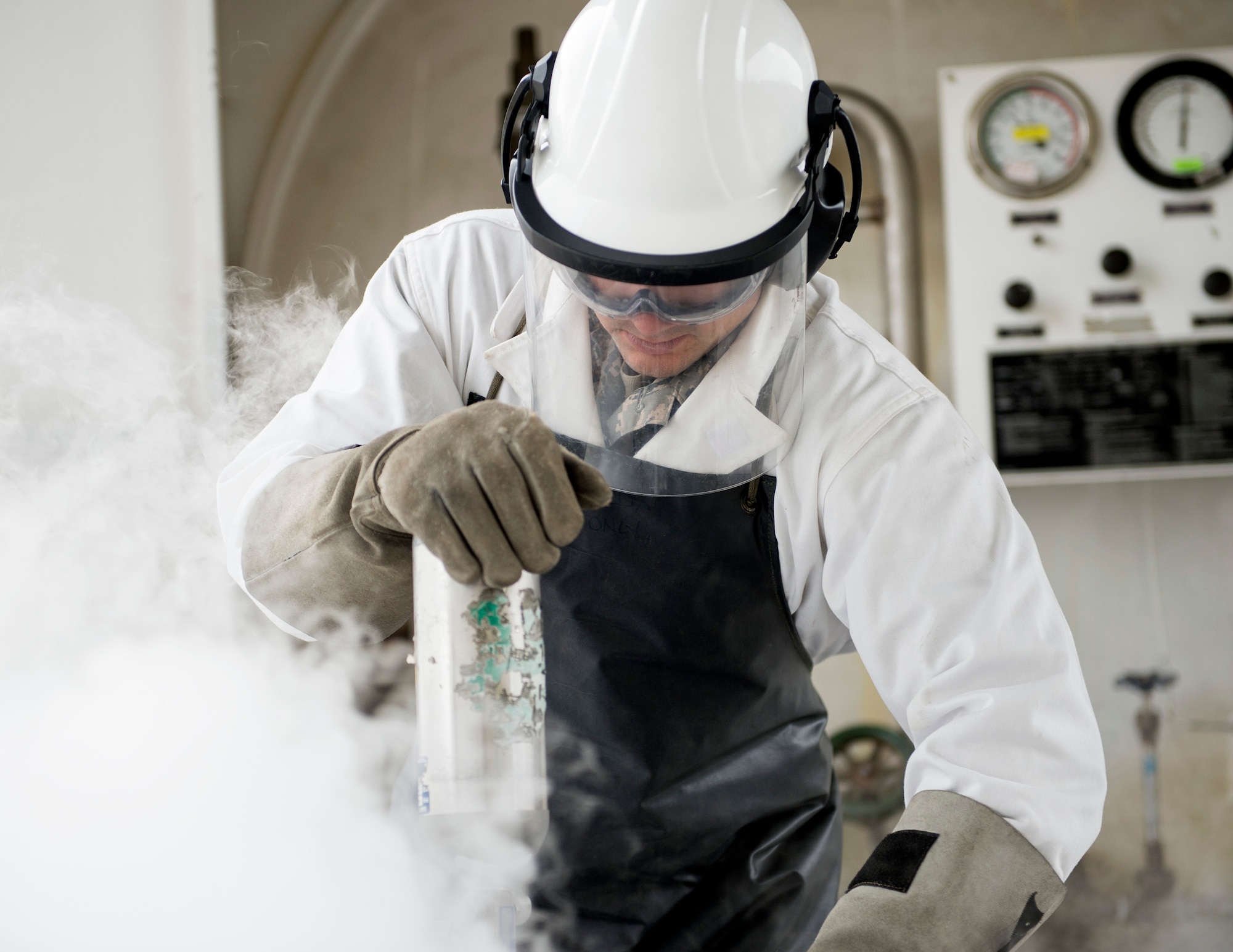 U.S. Air Force Tech. Sgt. Dustin Legatt, a fuels specialist with the 133rd Petroleum, Oil and Lubricants Flight, waits for the cryogenic cylinder to pressurize in St. Paul, Minn., July 10, 2019.