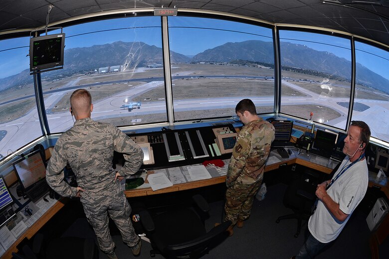 75th Operations Squadron air traffic controllers (left to right) Senior Airman Charles Parks, Senior Airman Jonathon Blanks and John Jobst watch closely from the control tower cab as Col. James Doyle, 413th Flight Test Group test pilot, taxis past after landing on taxiway Alpha in an A-10 Thunderbolt II at the end of a functional check flight at Hill Air Force Base, Utah, July 10, 2019.  The runway at Hill AFB was closed for most of the summer, requiring test pilots to temporarily use the taxiway as a runway. (U.S. Air Force photo by Alex R. Lloyd)