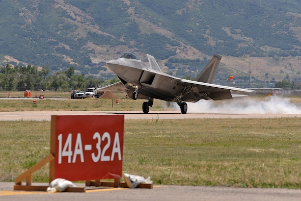 Maj. Philip Johnson, 514th Flight Test Squadron test pilot, smokes the tires upon touching down on taxiway Alpha in an F-22 Raptor after a functional check flight at Hill Air Force Base, Utah, July 1, 2019.  The runway at Hill AFB was closed for most of the summer, requiring test pilots from the 514th to temporarily use the taxiway as a runway. (U.S. Air Force photo by Alex R. Lloyd)