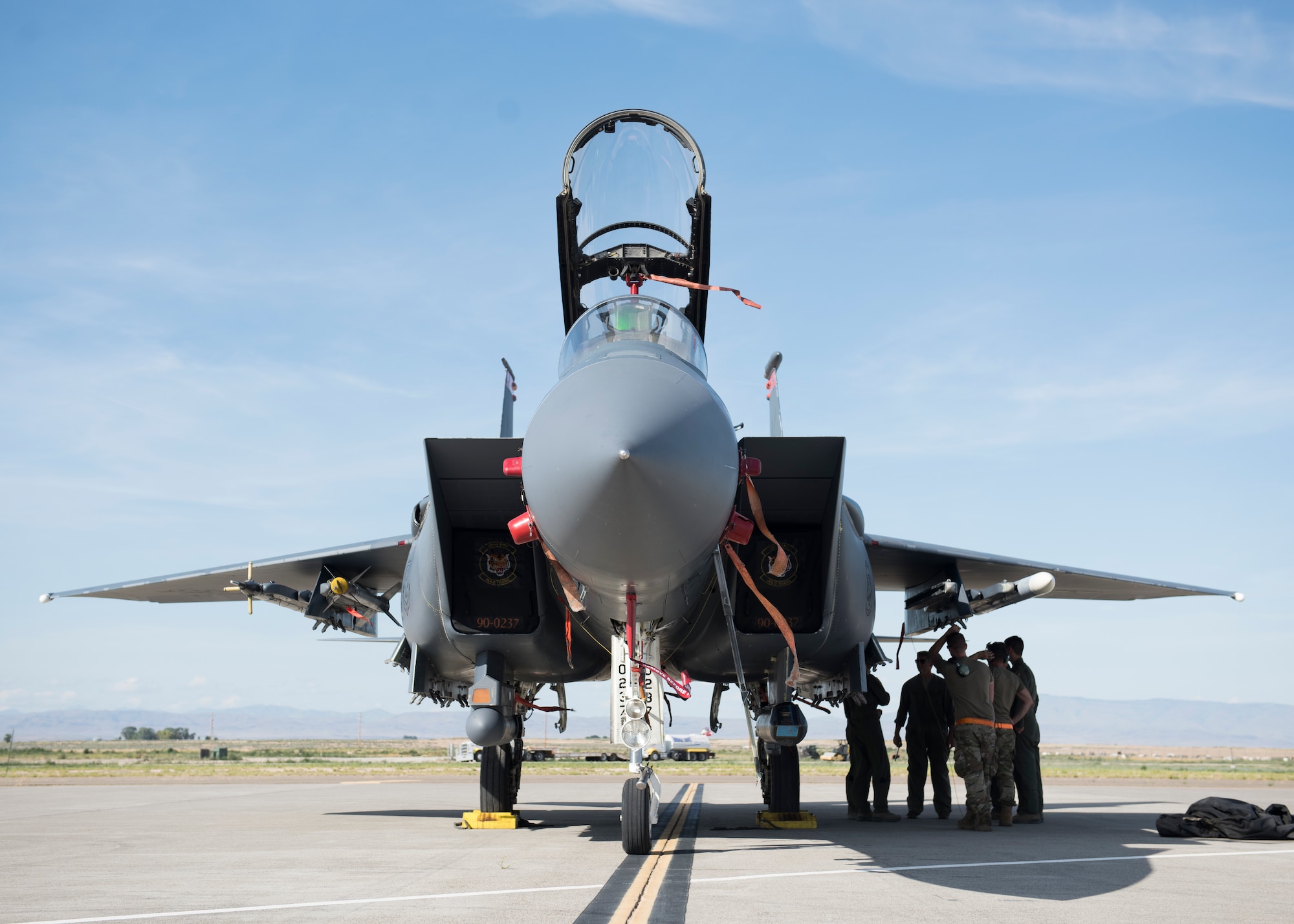An F-15E awaits re-arming during the Adaptive Basing exercise July 17, 2019, at Mountain Home Air Force Base. This training was done in order for the fighter squadrons to sharpen their Adaptive Basing strategies, enhancing it's potential down range. (U.S. Air Force photo by Senior Airman Tyrell Hall)