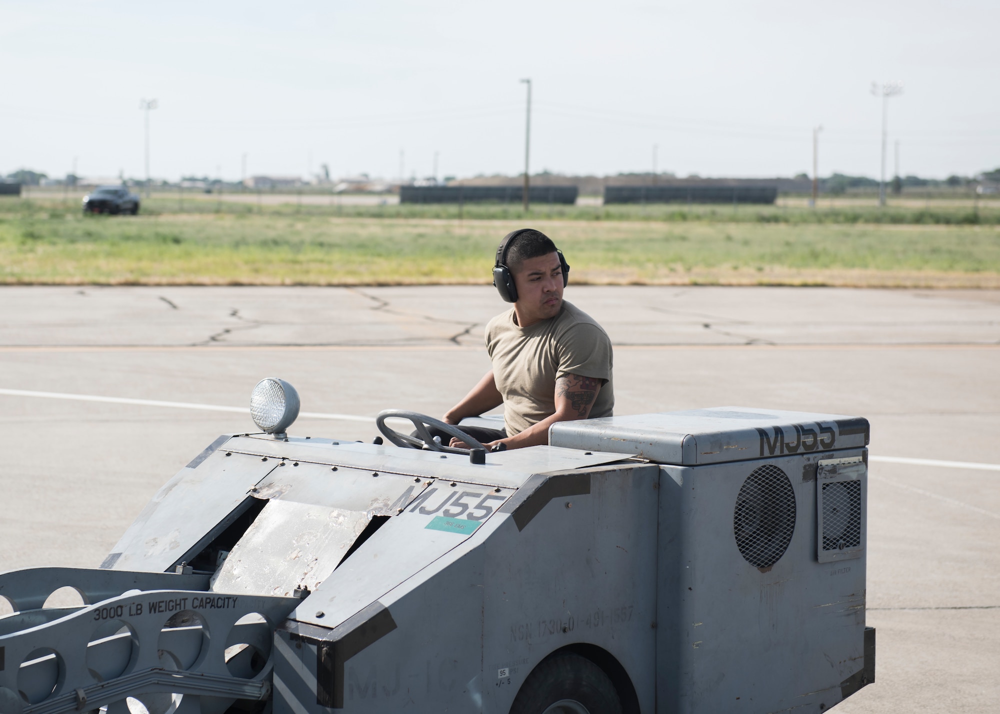 Senior Airmen Jonathan Castelan Medina moves training equipment to an F-15E Strike Eagle during the Adaptive Basing exercise July 17, 2019, at Mountain Home Air Force Base. This training was done in order for the fighter squadrons to sharpen their Adaptive Basing strategies, enhancing it's potential down range. (U.S. Air Force photo by Senior Airman Tyrell Hall)