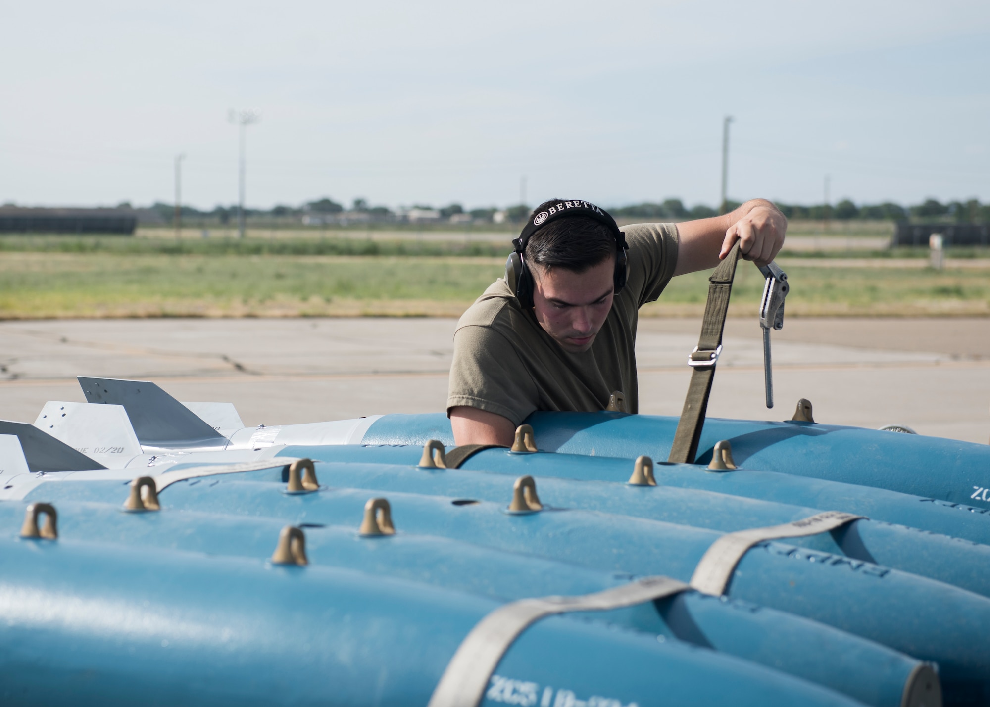 Staff Sgt. Timothy Chouinard, 391st Fighter Squadron, weapopns load crew chief, directs a load of training equipment into an F-15E Strike Eagle during the Adaptive Basing exercise July 17, 2019 at Mountain Home Air Force Base. This training was done in order for the fighter squadrons to sharpen their Adaptive Basing strategies, enhancing it's potential down range. (U.S. Air Force photo by Senior Airman Tyrell Hall)